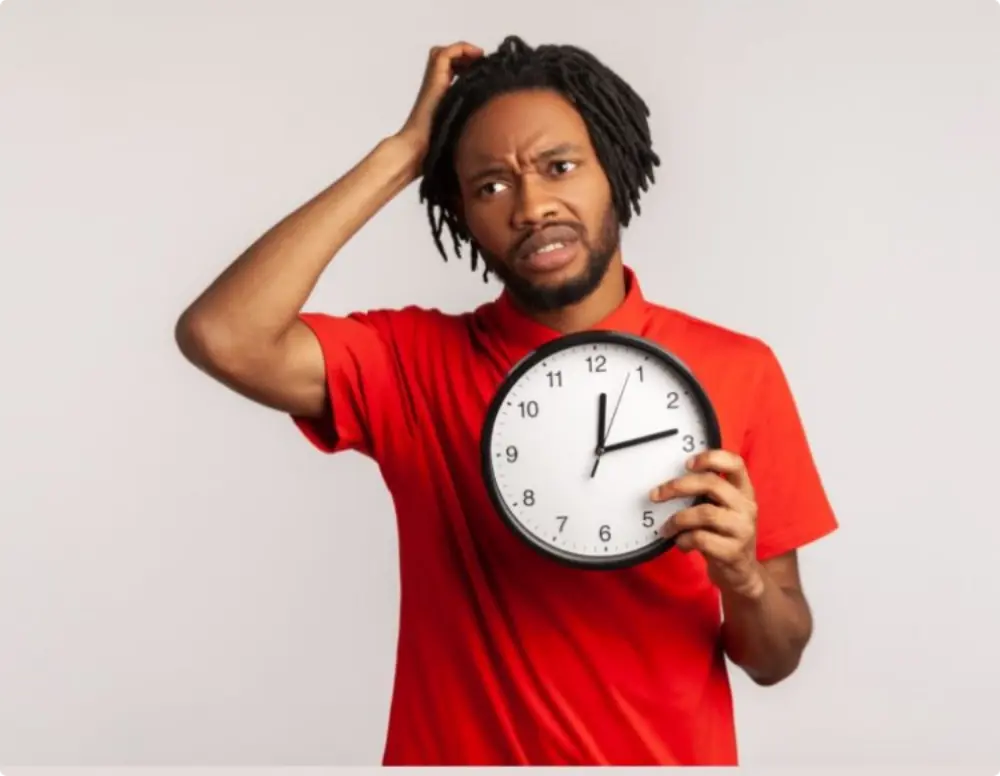 Man holding a clock
